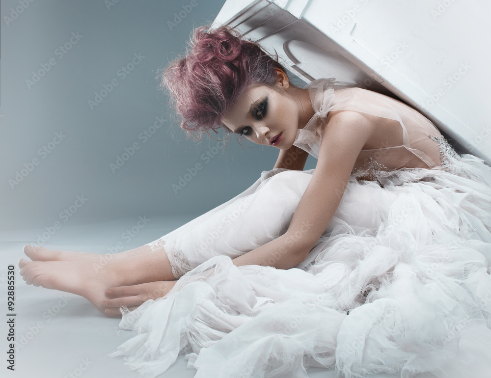 Portrait of a beautiful girl in a white dress and pink hair Portrait of a beautiful girl in a white dress and pink hair