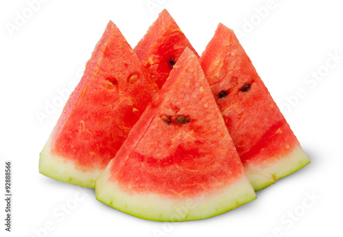 Four slices of ripe watermelon near