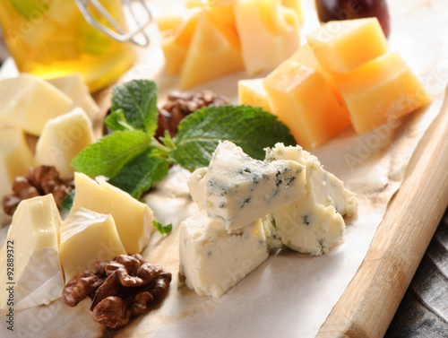 Assorted cheese on a wooden board