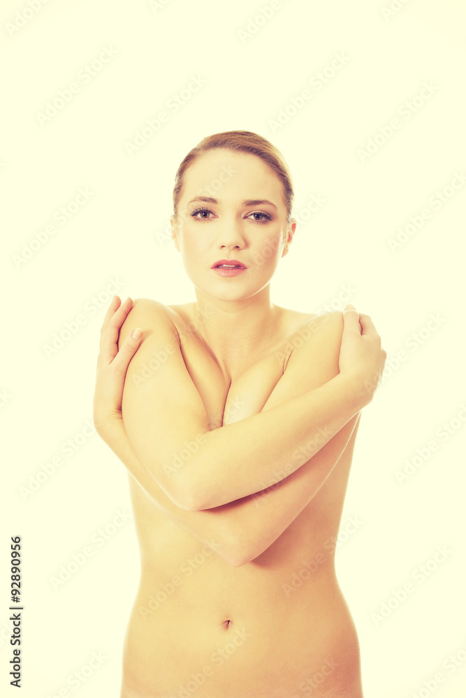 Fototapeta premium Young topless woman covering her breast.