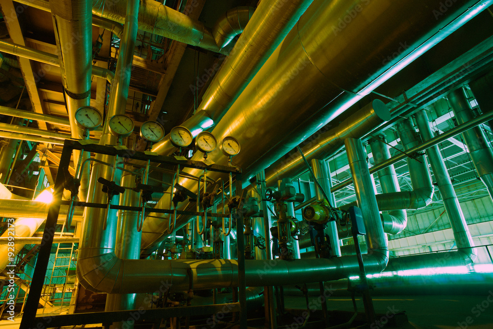 Equipment, cables and piping as found inside of a modern industr