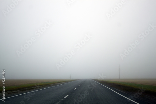 Highway or just road, leading in the fog and obscurity