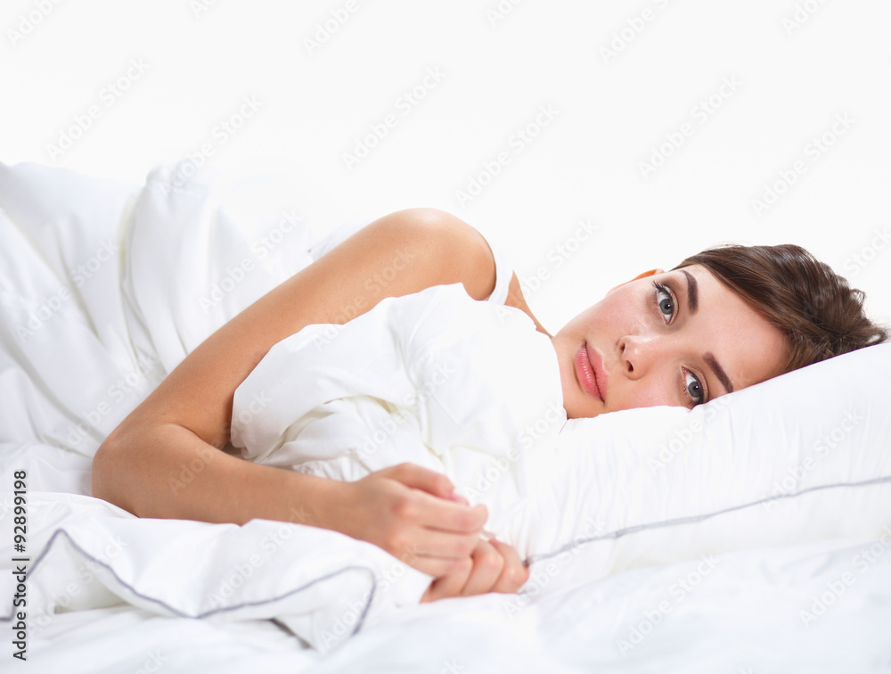 Beautiful girl sleeps in the bedroom, lying on bed Beautiful girl sleeps in the bedroom, lying on bed