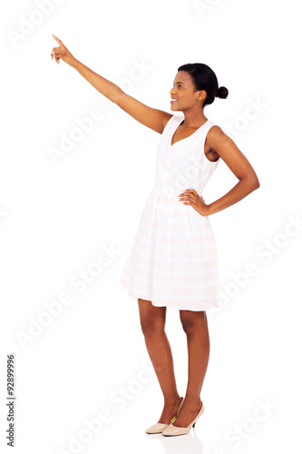 black woman pointing at empty space
