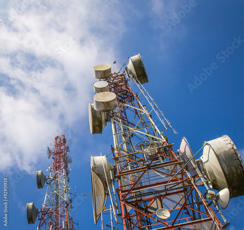 cellular communication towers on blue sky