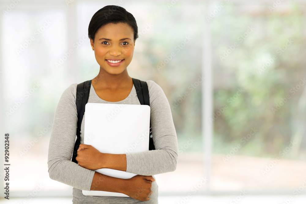 african american college student holding laptop african american college student holding laptop