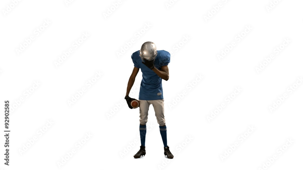 Disappointed american football player looking down Disappointed american football player looking down
