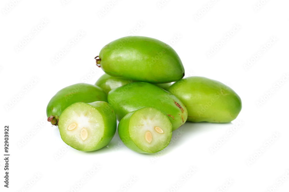 whole and cut Madan, Garcina tropical fruit on white background whole and cut Madan, Garcina tropical fruit on white background