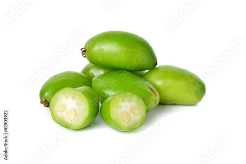 whole and cut Madan, Garcina tropical fruit on white background