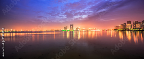 the surface of the river at dusk with metropolis