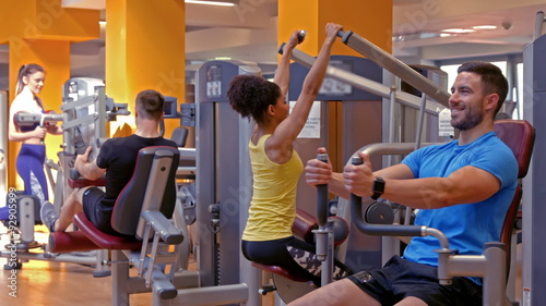 Fit people working out in gym