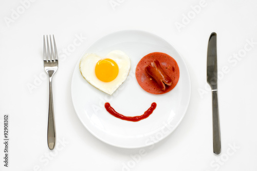 Smile for sweet breakfast with love with knife and fork on white background