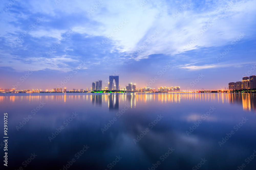 the surface of the river at dusk with metropolis