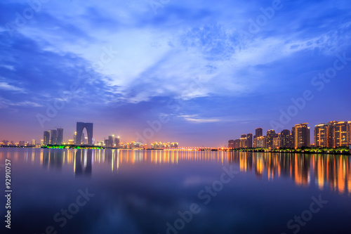 the surface of the river at dusk with metropolis