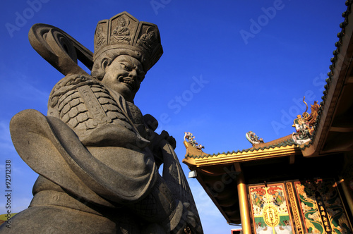 Stone sculpture of chinese god in chinese temple, China