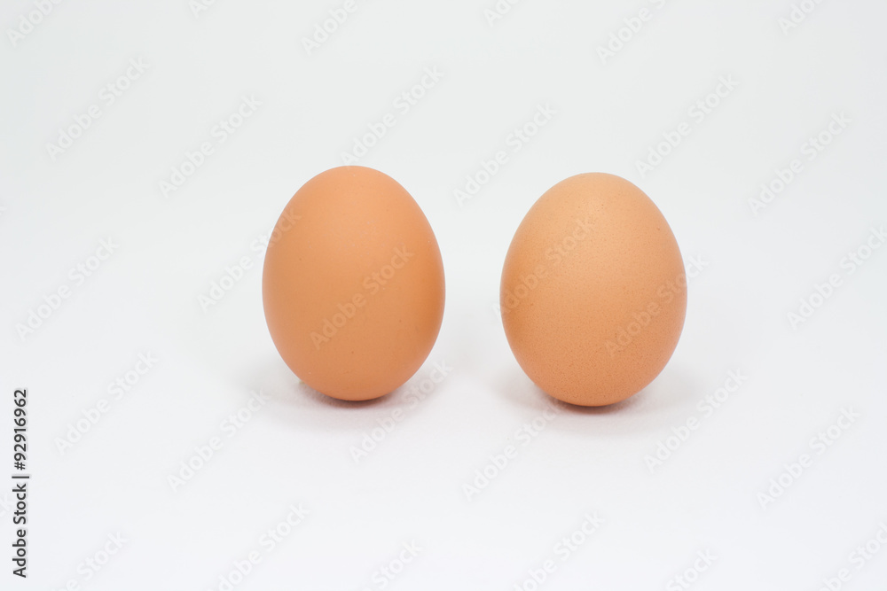 Two eggs placed vertically on a white background. Two eggs placed vertically on a white background.