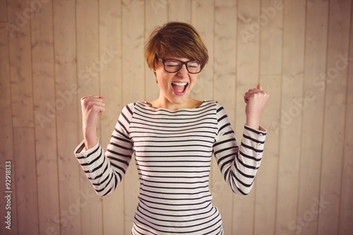 Attractive young woman celebrating victory
