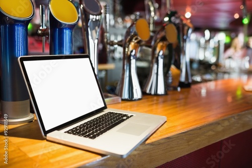 Laptop on bar counter