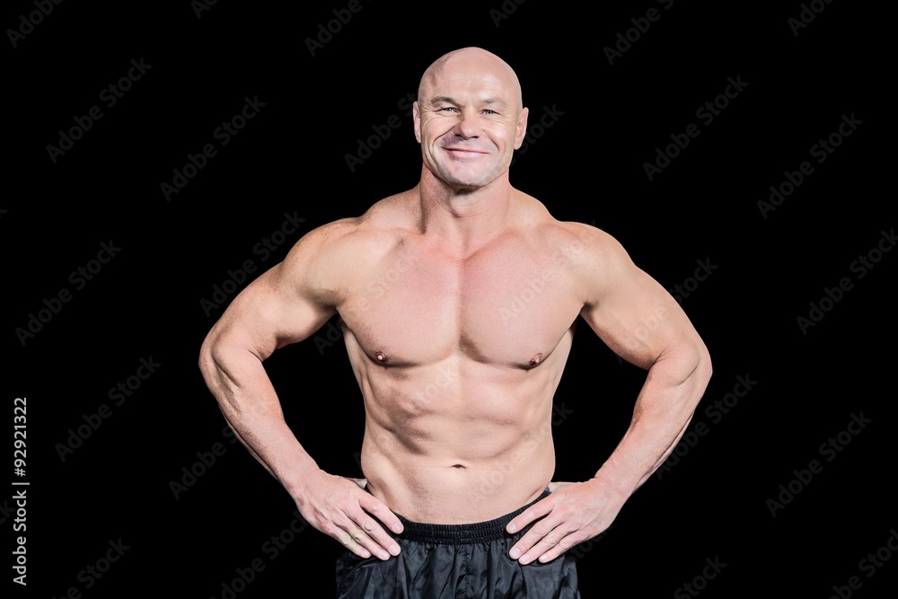 Portrait of smiling bald man with hand on hip Portrait of smiling bald man with hand on hip