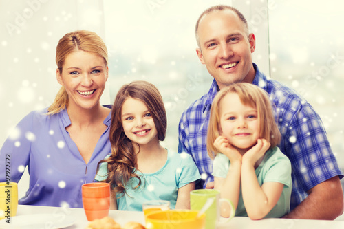 happy family with two kids having breakfast