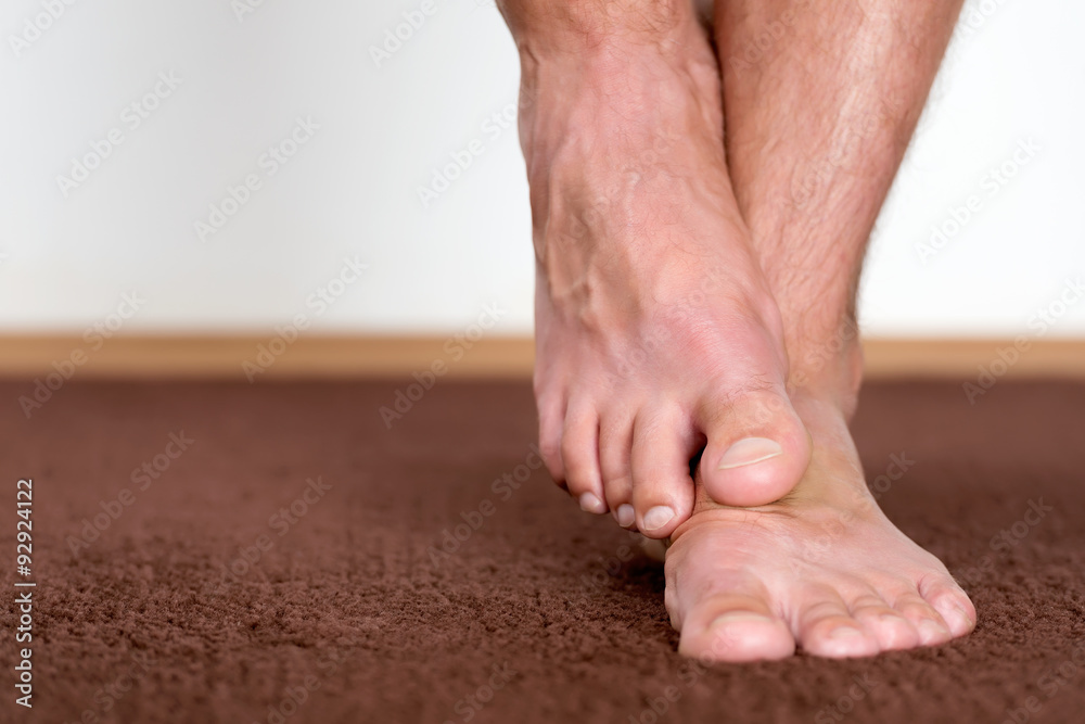 Scratching foot Scratching foot