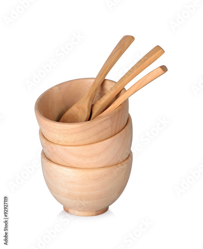 Cups and wooden spoons on white background