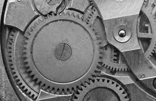 Black-and-white Metal Cogwheels in Clockwork. Macro