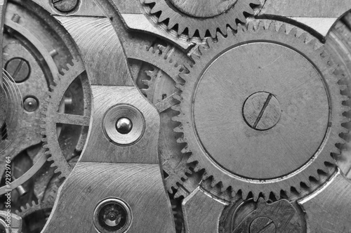 Black-and-white Metal Cogwheels in Clockwork. Macro