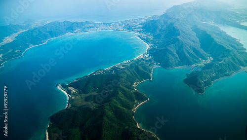 Japanese Mountain landscape from above; beautiful tropical island covered by trees and remote paradise beaches, Kyushu, Japan