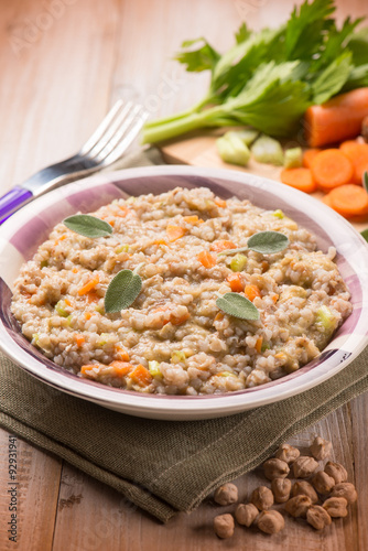 barley risotto with chickpeas and vegetables, selective focus