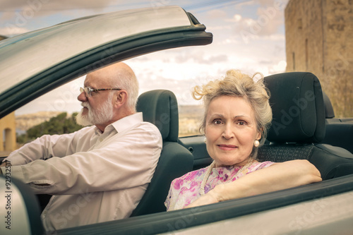 Elderly couple travelling by car © olly