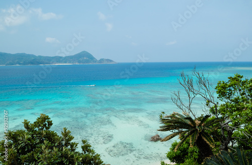 Tropical paradise island beach lagoon and white sand beach full of beautiful clear blue turquoise water in Amami Oshima, Kagoshima, Okinawa, Tropical Japan during Summer vacation