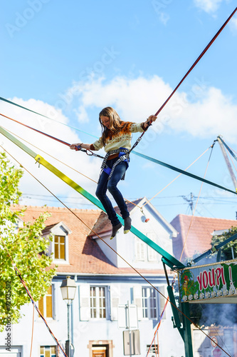 Photography Teenage girl jumping with bungie