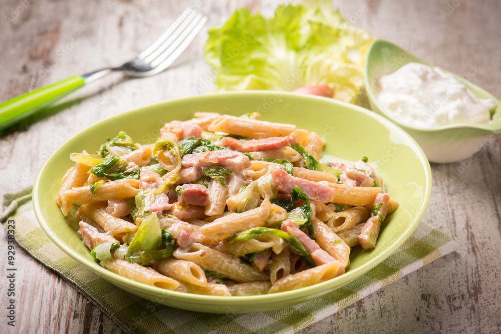 pasta with bacon lettuce and cream sauce, selective focus