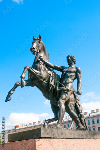 Sculpture tamer of horses at Anichkov bridge in St. Petersburg, Russia