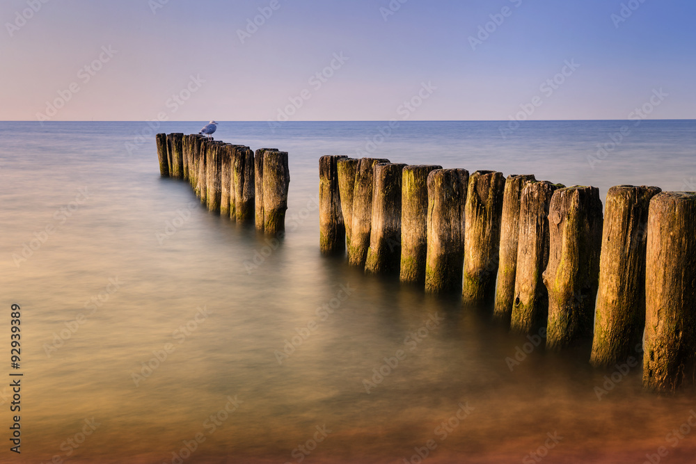 Long exposure breakwater photo. Baltic sea shore.