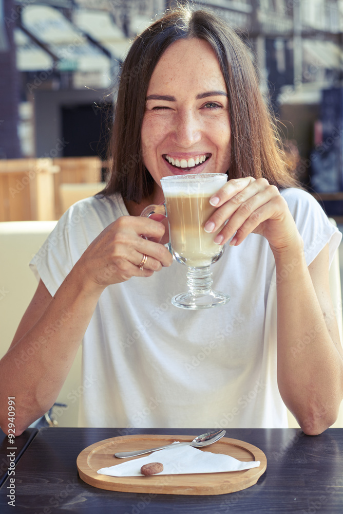 cheerful girl sitting in a cafe cheerful girl sitting in a cafe