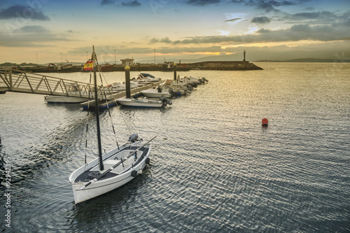 Sailboat anchored in harbor photo