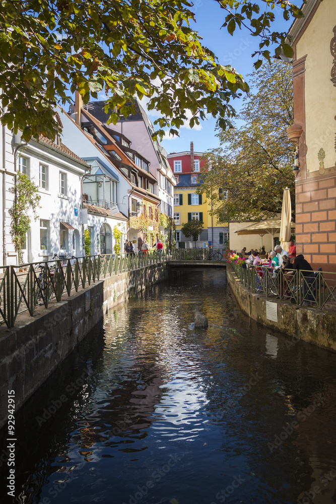 Old town street with canal in Freiburg