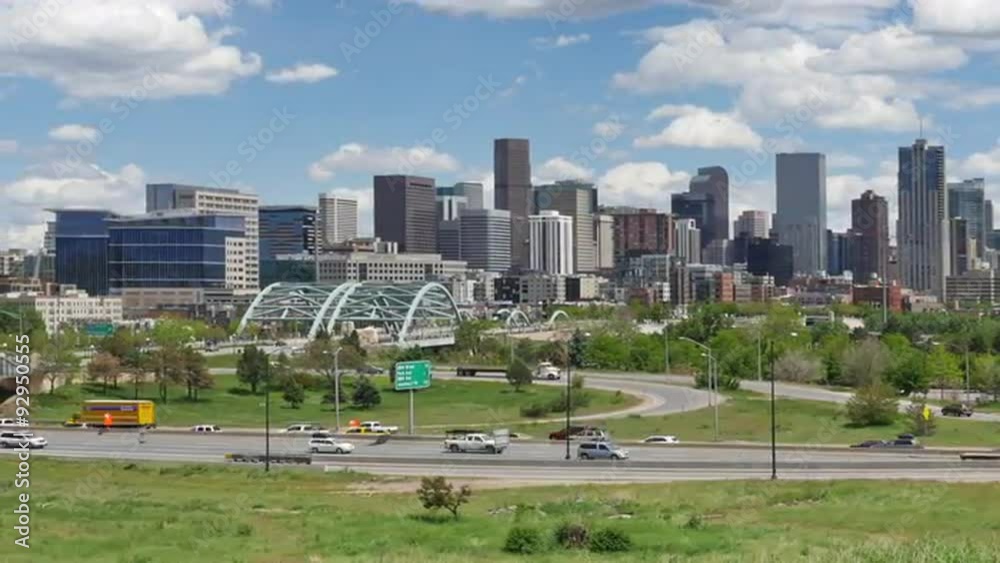 Time lapse pan of Denver skyline with Interstate traffic in the foreground and active clouds above. HD 1080p. Time lapse pan of Denver skyline with Interstate traffic in the foreground and active clouds above. HD 1080p.