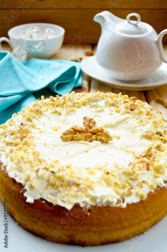 Homemade cake with butter cream and walnuts