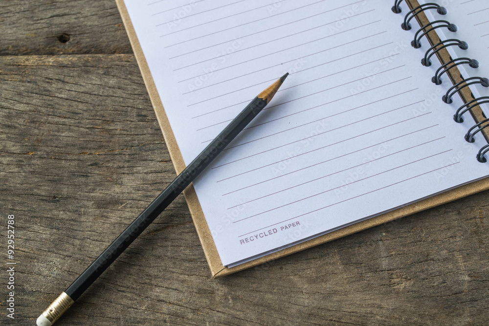 notebook recycling , pencil on wooden notebook recycling , pencil on wooden