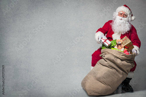 Santa Claus with a bag of presents photo