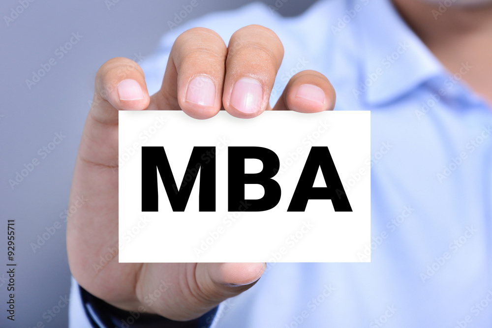 MBA letters (or Master of Business Administration) on the card shown by a man MBA letters (or Master of Business Administration) on the card shown by a man