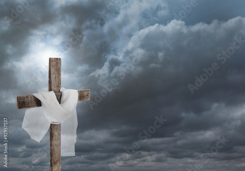 Cross with cloth on sky background photo