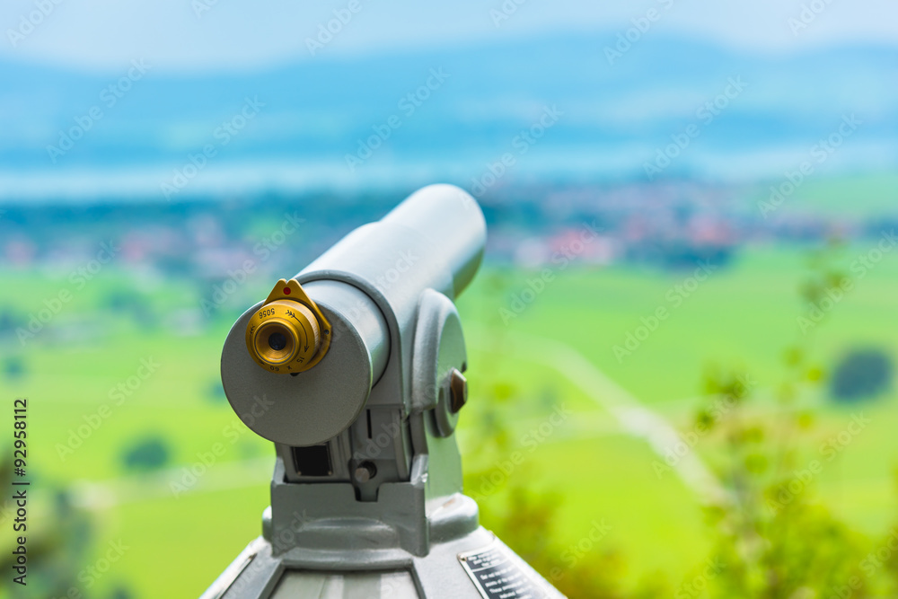 Image of a telescope overlooking for rural landscape Image of a telescope overlooking for rural landscape