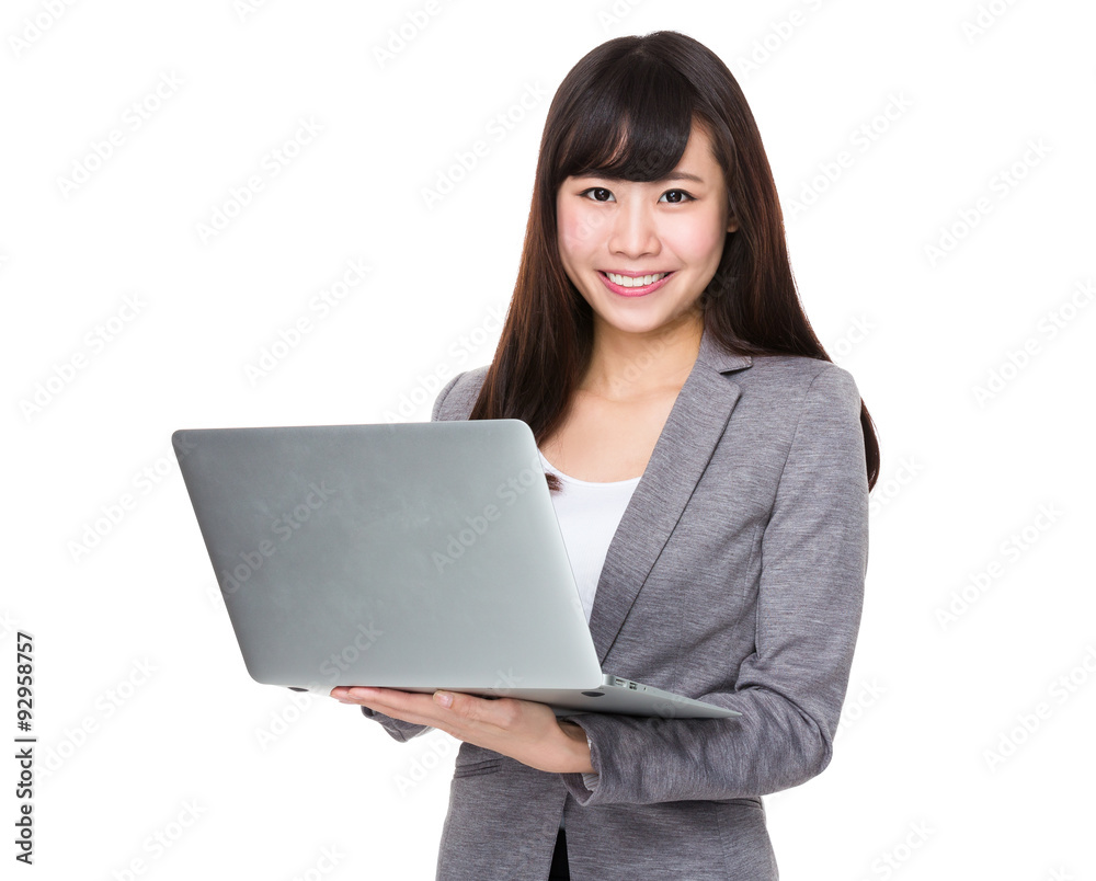 Asian Young businesswoman use of the notebook computer Asian Young businesswoman use of the notebook computer