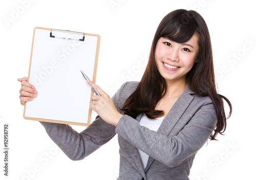 Asian businesswoman pen point to clipboard