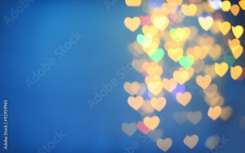 Festive background of lights in hearts shape