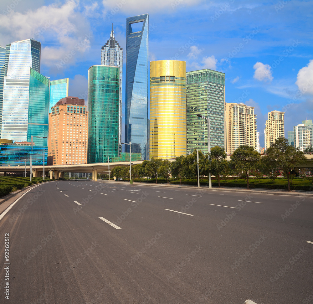 Empty road with Shanghai Lujiazui city buildings Empty road with Shanghai Lujiazui city buildings